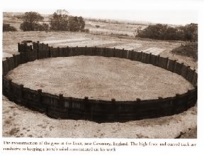 A reconstruction of an early round pen. The high fence and curved track keep a horseâ€™s mind concentrated on his work.
