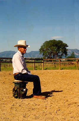 Tom watching the riders and horses 