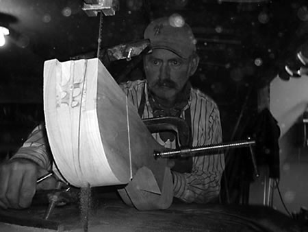 Frecker cuts out tree bars with a bandsaw and angle jig. The trees are made from yellow poplar for the bars and cantle, and the fronts are laminated baltic birch for added strength. 