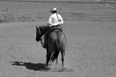 7. Here she is doing a nice job reaching her left front to the left and the right hind to the right; her flexion is good, my left leg is back, and my weight is now shifted to the right.