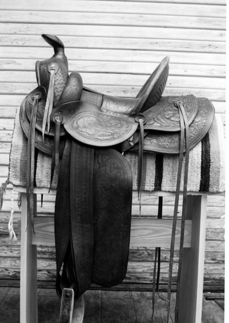Saddle from unknown maker. Note tubelike rolls, not removable circa early 20th century.
