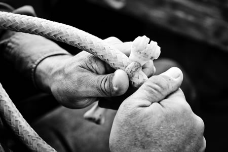 This bosal is a work in progress. Wald softens the rawhide by rubbing it with a bone. 