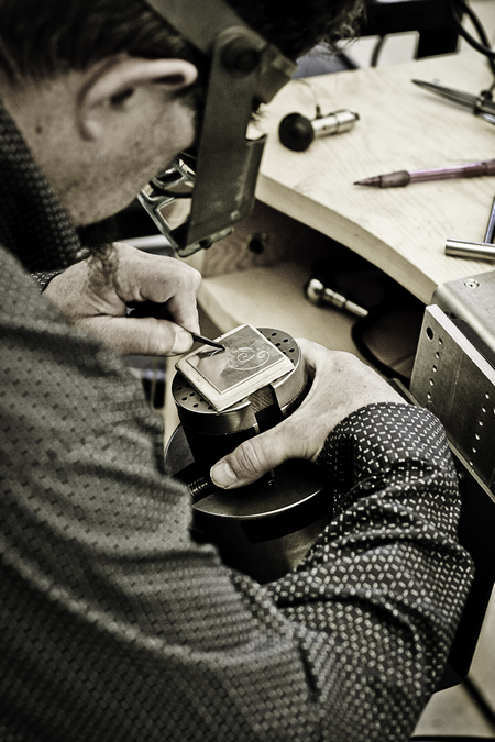 Alderson begins a scroll on a blank piece of silver. The silversmith learned the fundamentals of metal ornamentation by studying firearms-engraving techniques.