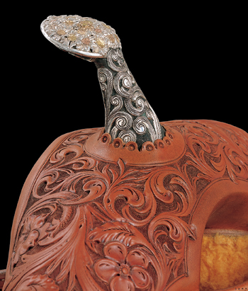 This exposed bronze horn adorns a 2004 Cary Schwarz saddle. Scott Hardy overlaid silver scrolls onto the horn’s stem, and decorated the top of the horn with a bouquet design featuring a half-dozen flower varieties. PHOTO COURTESY NATIONAL COWBOY & WESTERN HERITAGE MUSEUM 